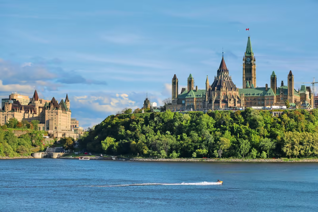Parliament Hill and the Fairmont Chateau Laurier rising above the Ottawa River