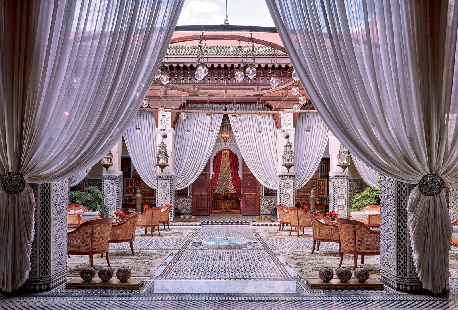 Luxury riad courtyard with zellige tiles and a fountain