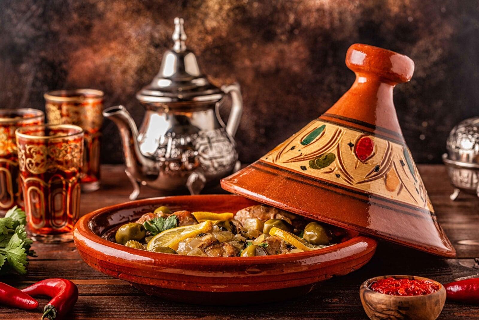 Moroccan tagine with vegetables and olives served in a clay pot