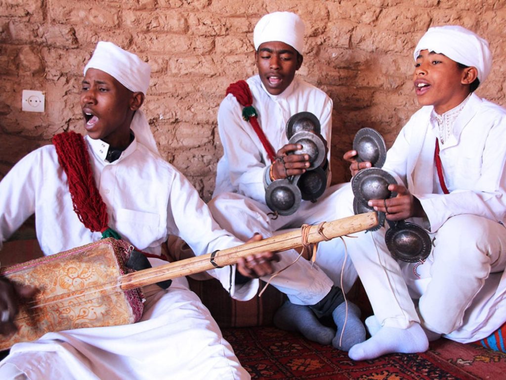 Traditional Moroccan musicians performing, reflecting the country's rich cultural heritage