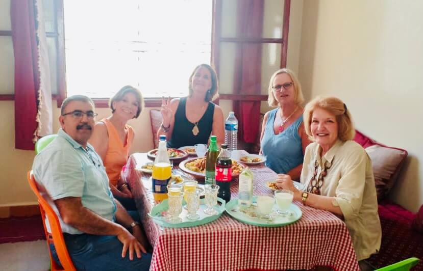 Private Morocco tour guests enjoying a traditional Moroccan lunch with their Gateway2Morocco driver