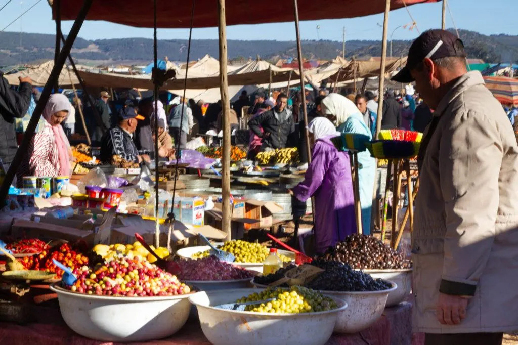Olives and preserved lemons piled high at a Berber market in Morocco