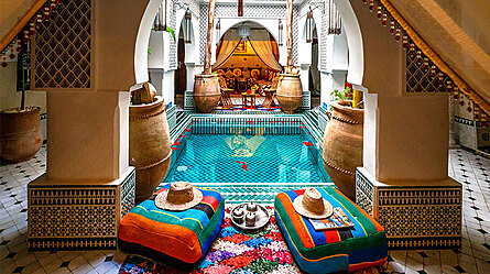 Traditional Moroccan riad courtyard with fountain and zellige tilework