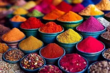 Colorful piles of Moroccan spices in a market stall
